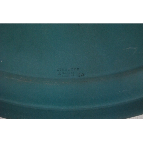 236 - Four pieces of Wedgwood sea green Jasper ware to include a bowl, oval dish and a pair of spill vases... 