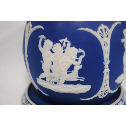 240 - Two pieces of Wedgwood green Jasper ware comprising a vase and a wall plate, decorated with classica... 