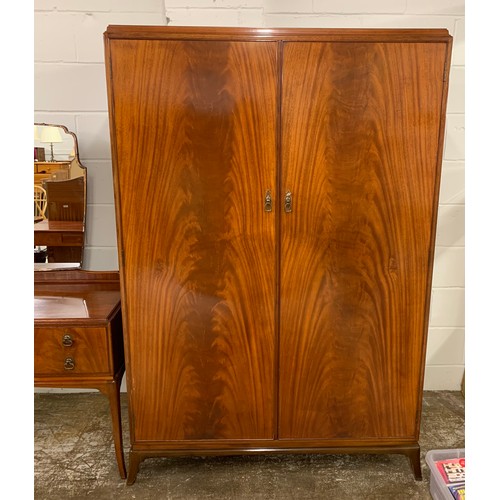 458 - 1930s mahogany three piece bedroom suite comprising of four drawer chest, mirror back dressing table... 