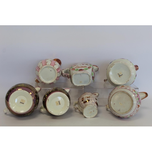 276 - Graduated pair of 19th century pottery jugs with copper and pink lustre banding and polychrome paint... 