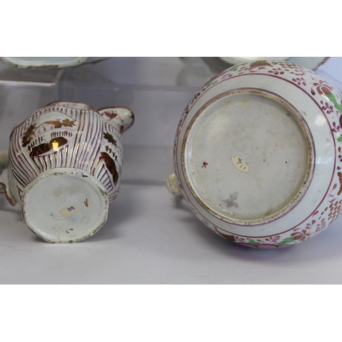 276 - Graduated pair of 19th century pottery jugs with copper and pink lustre banding and polychrome paint... 