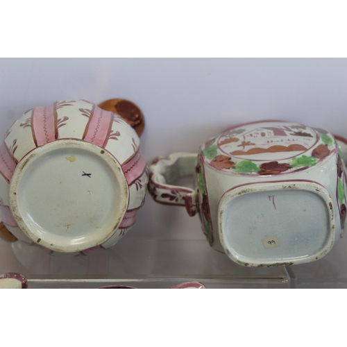 276 - Graduated pair of 19th century pottery jugs with copper and pink lustre banding and polychrome paint... 