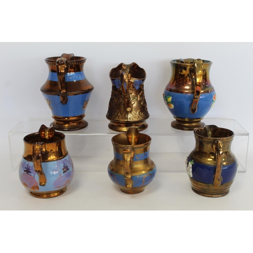 277 - Six Victorian copper lustre jugs, four with moulded decoration, the largest 16.5cm high.  (6).