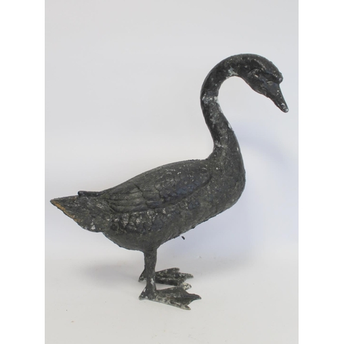 280 - Black painted cast metal garden ornament in the form of a swan, 58cm high.