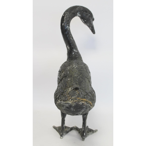 280 - Black painted cast metal garden ornament in the form of a swan, 58cm high.