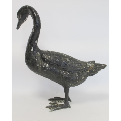 280 - Black painted cast metal garden ornament in the form of a swan, 58cm high.