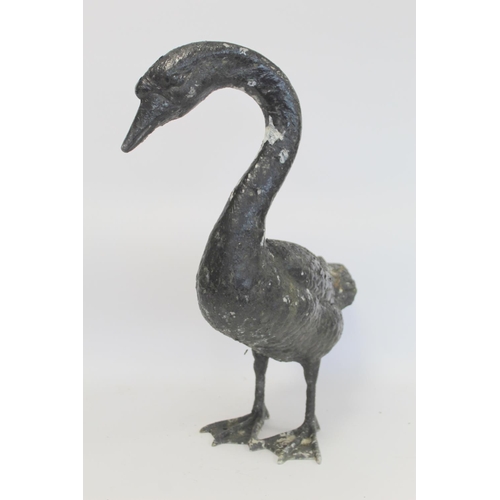 280 - Black painted cast metal garden ornament in the form of a swan, 58cm high.