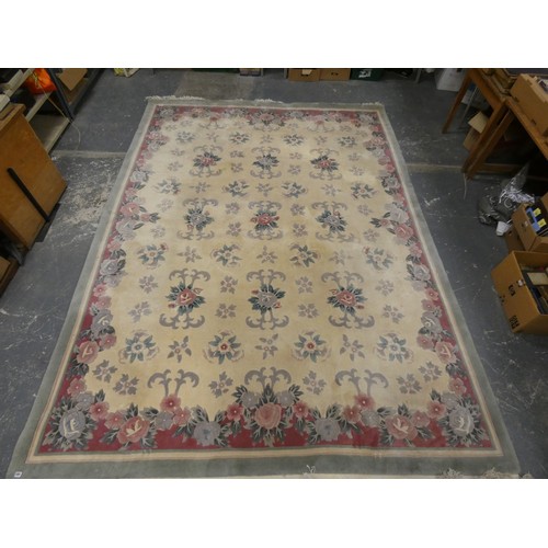 454 - Chinese large wool on cotton carpet, the cream field with all over floral decoration in pink and gre... 