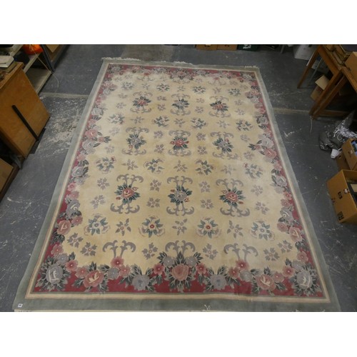 454 - Chinese large wool on cotton carpet, the cream field with all over floral decoration in pink and gre... 