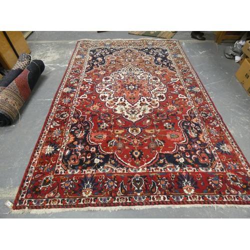 455 - Persian Bahktiari rug, the hand knotted rug with central floral medallion within all over floral mot... 