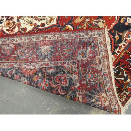 455 - Persian Bahktiari rug, the hand knotted rug with central floral medallion within all over floral mot... 