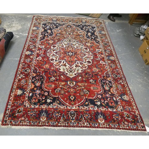 455 - Persian Bahktiari rug, the hand knotted rug with central floral medallion within all over floral mot... 