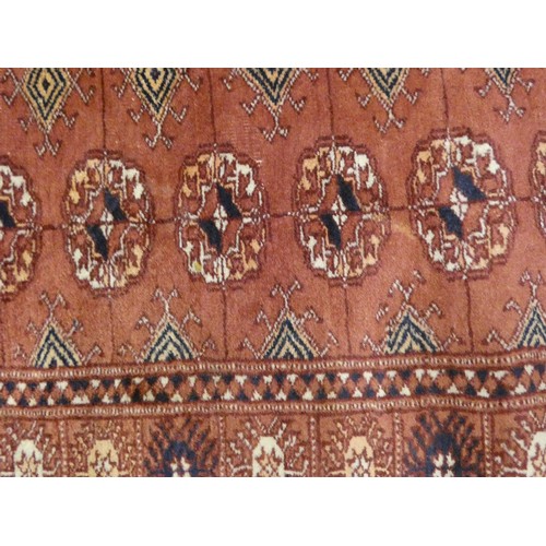 459 - Bokhara runner, with twenty six rows of two geometric motifs to the centre and border on red ground,... 