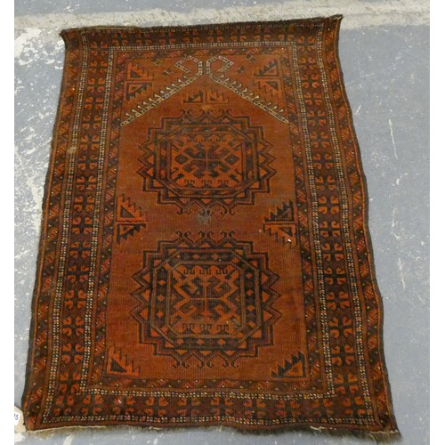 461 - Afghan rug, the small antique hand knotted rug with two geometric medallions on rust ground, 100cm x... 