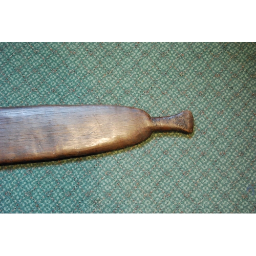 214 - Aboriginal fish tail paddle club (Rainforest sword), with shaped grip, 147.5cm long and 13.5cm wide.