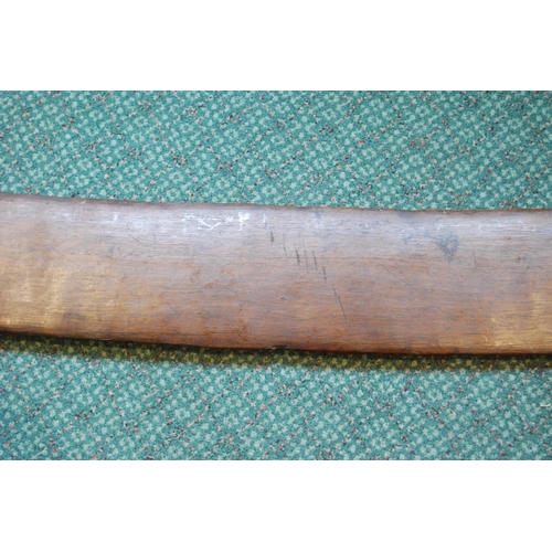 214 - Aboriginal fish tail paddle club (Rainforest sword), with shaped grip, 147.5cm long and 13.5cm wide.