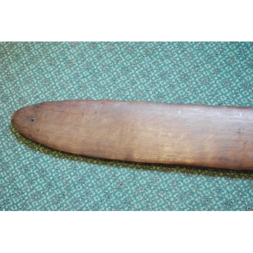 214 - Aboriginal fish tail paddle club (Rainforest sword), with shaped grip, 147.5cm long and 13.5cm wide.