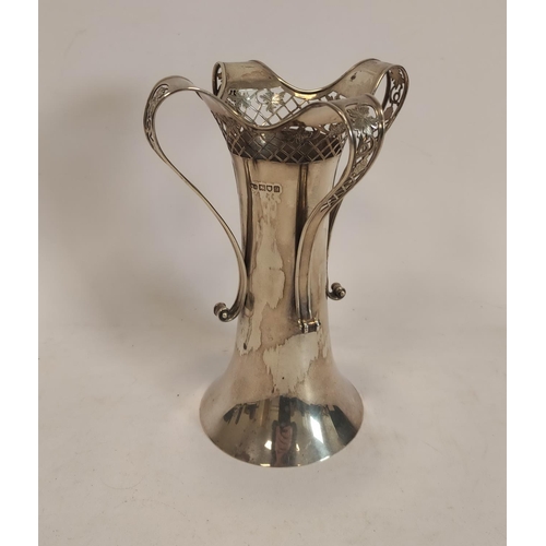 101 - Silver vase of spool shape with pierced band and four loop handles for Harrod's London 1911. 22.5cm,... 