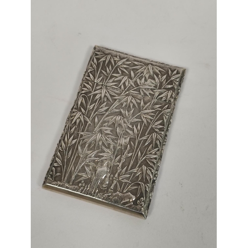 104 - Chinese silver card case embossed with scenes of figures in landscapes with bamboo palm building, by... 