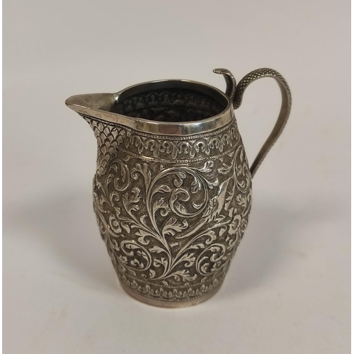 108 - Indian embossed silver cream jug, with serpent handle and a similar jar and cover, 198g / 6oz.