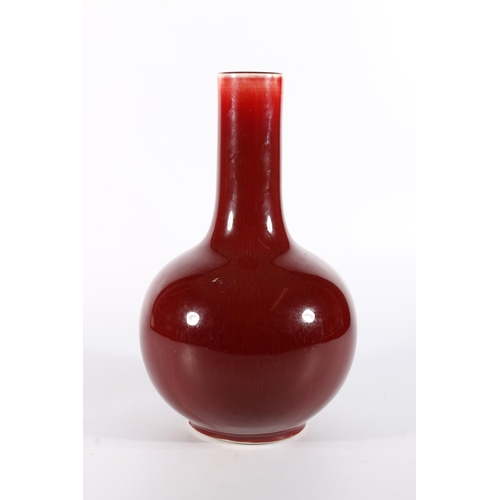 110 - Chinese pottery bottle vase with sang de boeuf  red flambe glaze, seal mark to the base, 27cm tall.