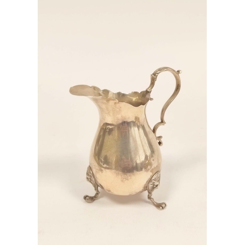 102 - Silver cream jug of Georgian style, pear shaped on lion mask and paw feet, London 1906. 100g, 3oz.