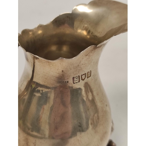 102 - Silver cream jug of Georgian style, pear shaped on lion mask and paw feet, London 1906. 100g, 3oz.