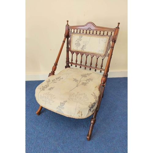 499 - Late Victorian Aesthetic walnut nursing chair in the manner of Christopher Dresser, with turned spin... 