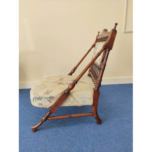 499 - Late Victorian Aesthetic walnut nursing chair in the manner of Christopher Dresser, with turned spin... 