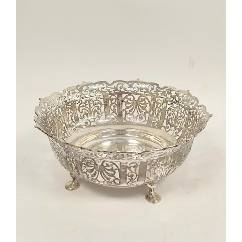 123 - George V pierced silver fruit bowl, circular form raised on four pad feet, diameter 25cm, London 191... 