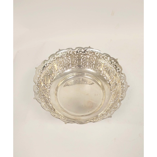 123 - George V pierced silver fruit bowl, circular form raised on four pad feet, diameter 25cm, London 191... 