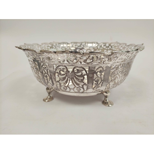 123 - George V pierced silver fruit bowl, circular form raised on four pad feet, diameter 25cm, London 191... 