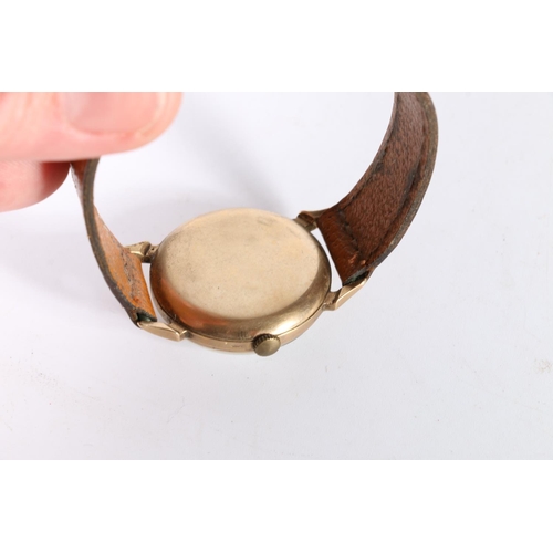 80 - 9ct gold Smiths gents wristwatch on tone leather strap.