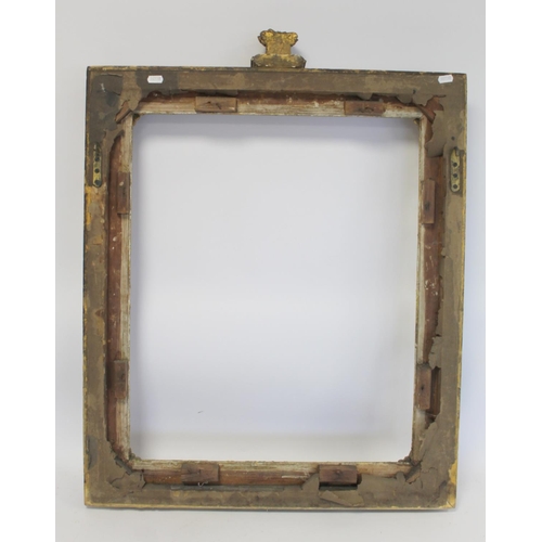 298 - 19th century gilt picture frame with floral and foliate scroll gesso moulding, the top surmounted by... 