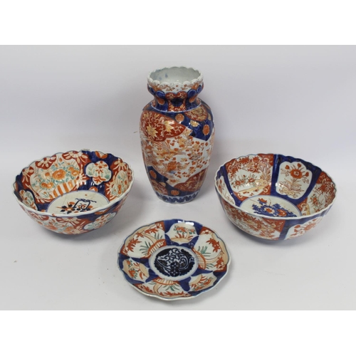 317 - Four pieces of late 19th century Japanese Imari porcelain comprising: ribbed baluster vase decorated... 