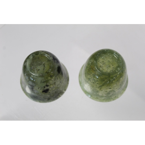 324 - Pair of Chinese mottled green jade cups, each 5cm high.  (2).