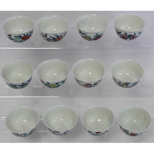 327 - Twelve small Chinese porcelain wine cups decorated with flowers and fruit, each 6cm diam. and 3.5cm ... 