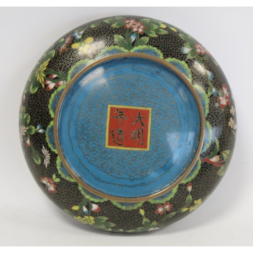 328 - 19th or early 20th century Chinese black cloisonné shallow circular bowl with polychrome flor... 