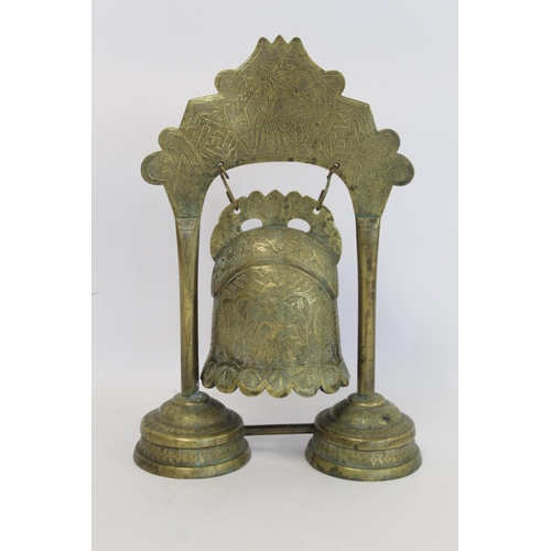 330 - Burmese brass temple bell on stand with incised panels of figures, foliate scroll borders, etc., 57.... 