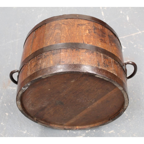 314 - Antique oak planter or log bucket of coopered twin handled barrel form, approx. 62cm wide, 30cm high... 