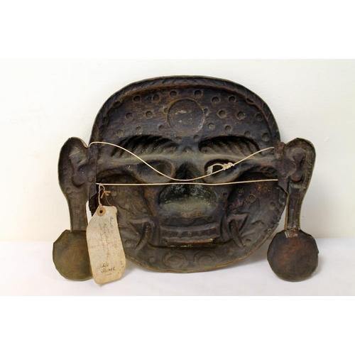 380 - Tibetan Mahakala bronze mask with repoussé features, protruding tongue, pendulous earlobes and fangs... 