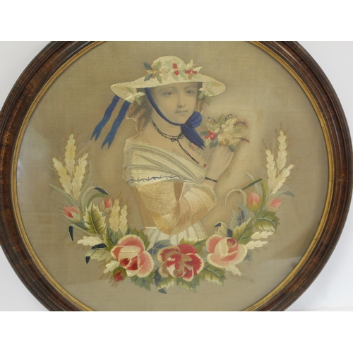 402 - Victorian silk embroidery of a girl holding a posy of flowers with wreath of roses and grasses below... 