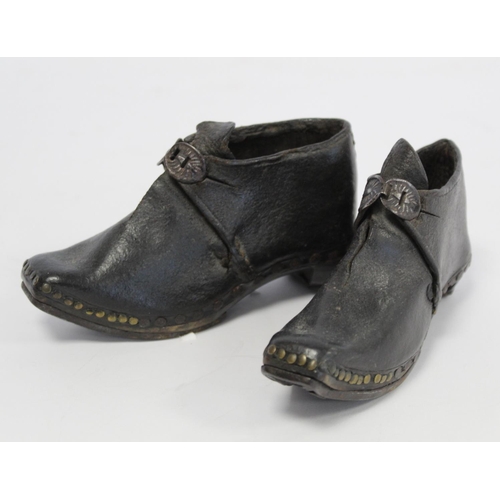 410 - Pair of 19th century child's clogs with metal buckles, riveted detail and steel to sole and heels, e... 