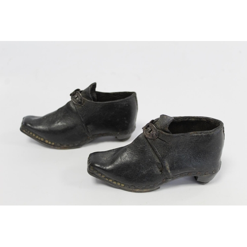 410 - Pair of 19th century child's clogs with metal buckles, riveted detail and steel to sole and heels, e... 