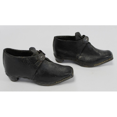 410 - Pair of 19th century child's clogs with metal buckles, riveted detail and steel to sole and heels, e... 