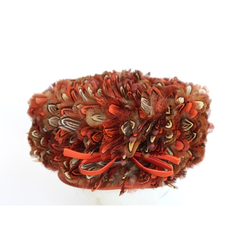 414 - Vintage lady's formal hat, the iron red satin crown covered in red and brown feathers; a vintage sil... 