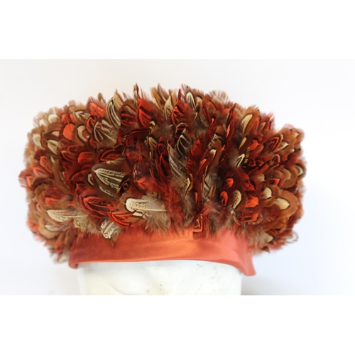 414 - Vintage lady's formal hat, the iron red satin crown covered in red and brown feathers; a vintage sil... 