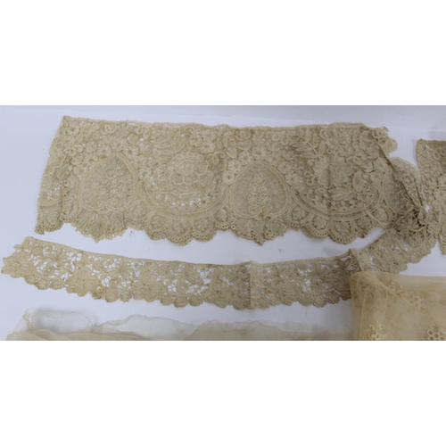 425 - Antique lace veil of square form, approx. 108cm x 108cm and four pieces of lace trim.