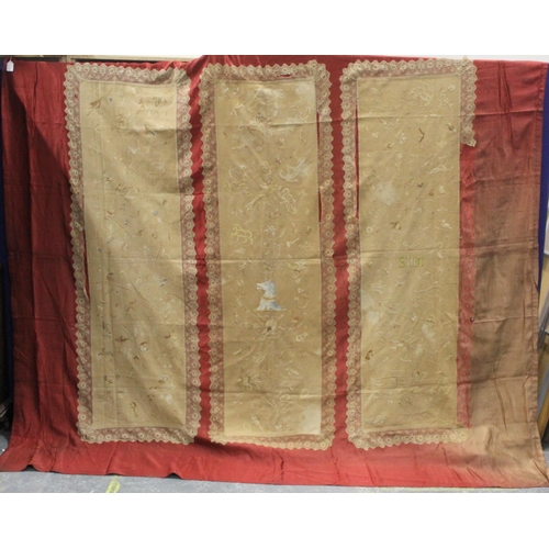 427 - Antique bedspread with three appliqued embroidered panels, the natural scrim fields worked in silk t... 