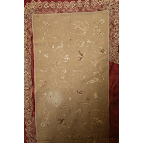 427 - Antique bedspread with three appliqued embroidered panels, the natural scrim fields worked in silk t... 